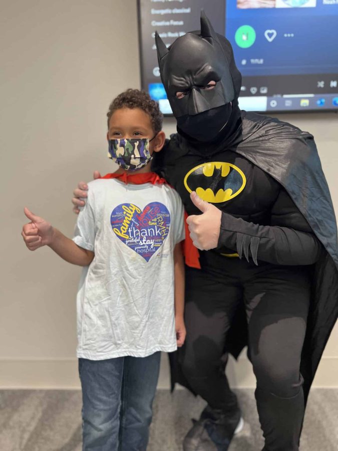 Image from Moments of Joy - A boy in a picture with Batman