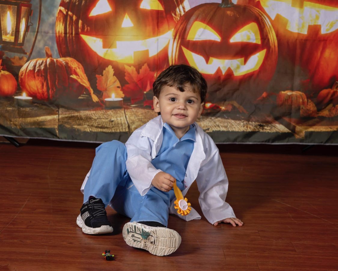 Image from Halloween in our House - Little boy holding a ribbon