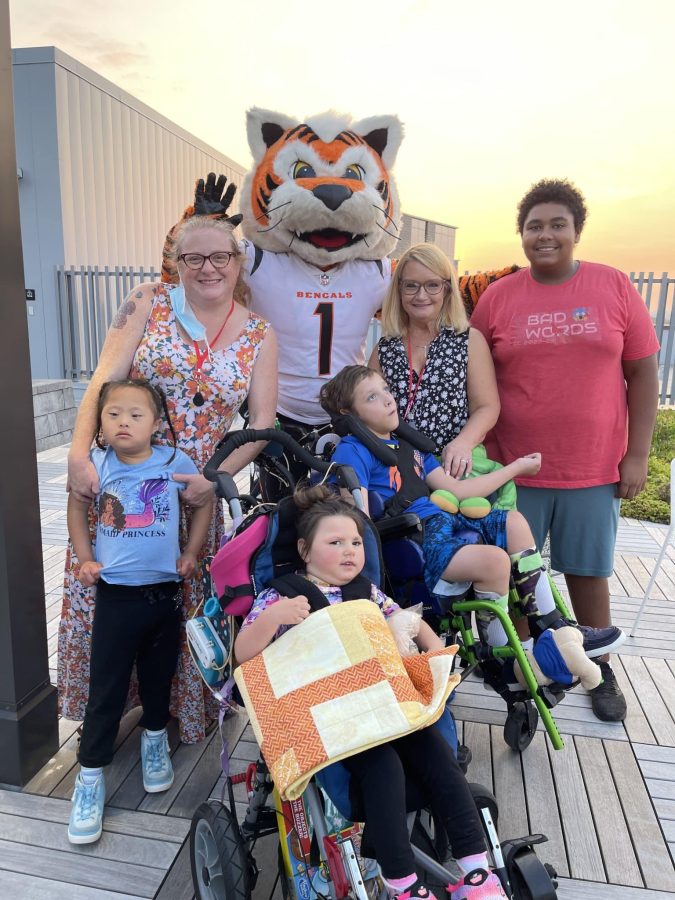Image from Moments of Joy - Group family picture with a Bengals mascot