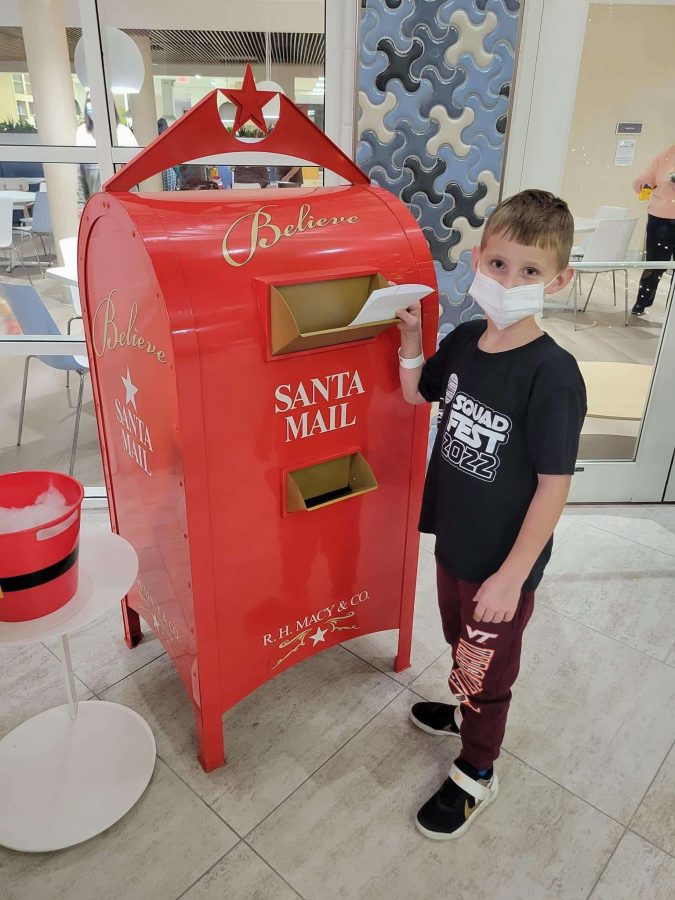 Image from Comfort and Joy - Kid mailing a letter to Santa Mail