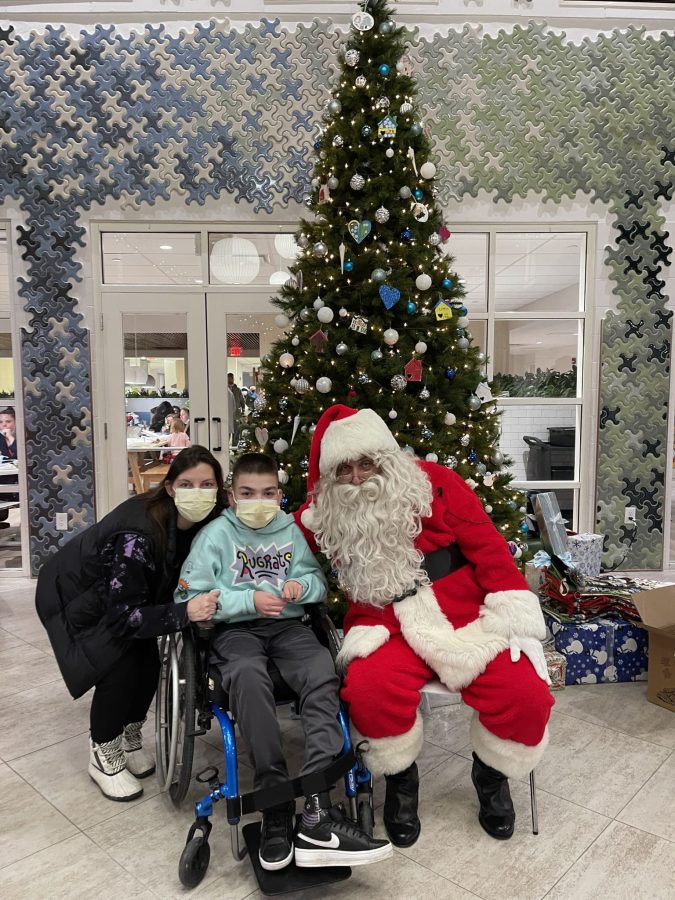 Image from Comfort and Joy - A kid in a wheelchair with Santa