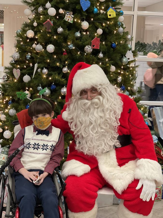 Image from Comfort and Joy - Kid in a wheelchair with Santa