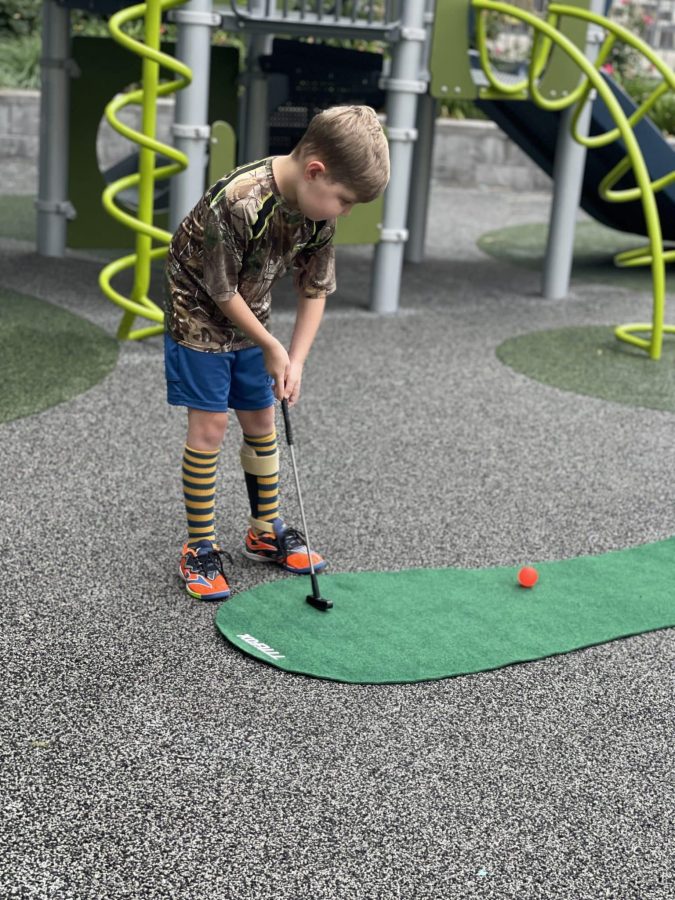 Image from Family Fun Nights - Kid playing golf