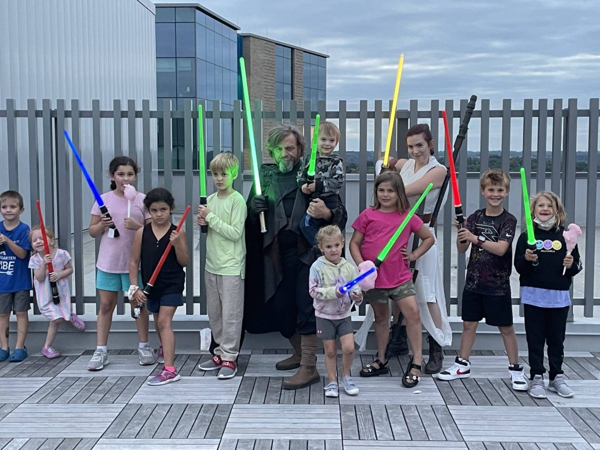 Image from Moments of Joy - A group of kids with their lightsabers