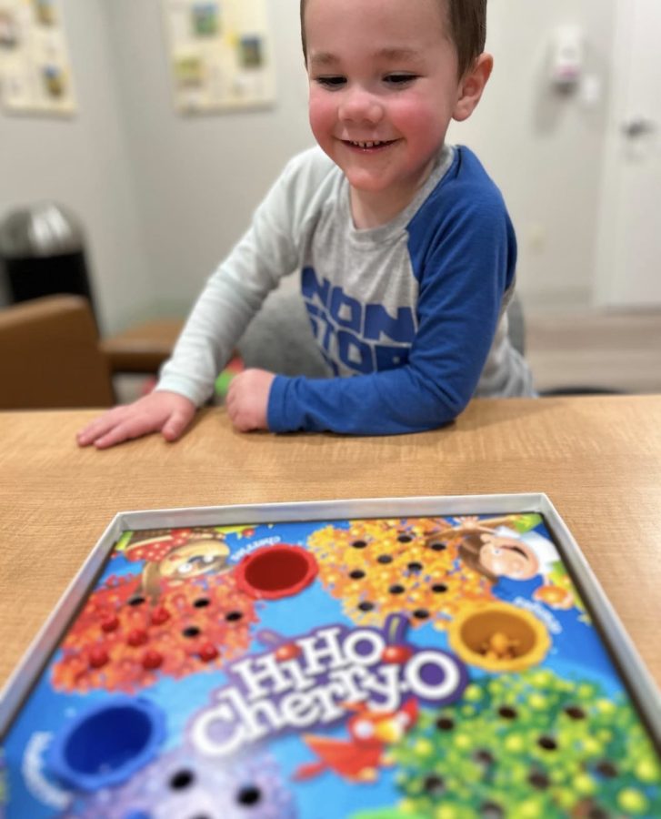 Image from Programs they love - Boy playing board games