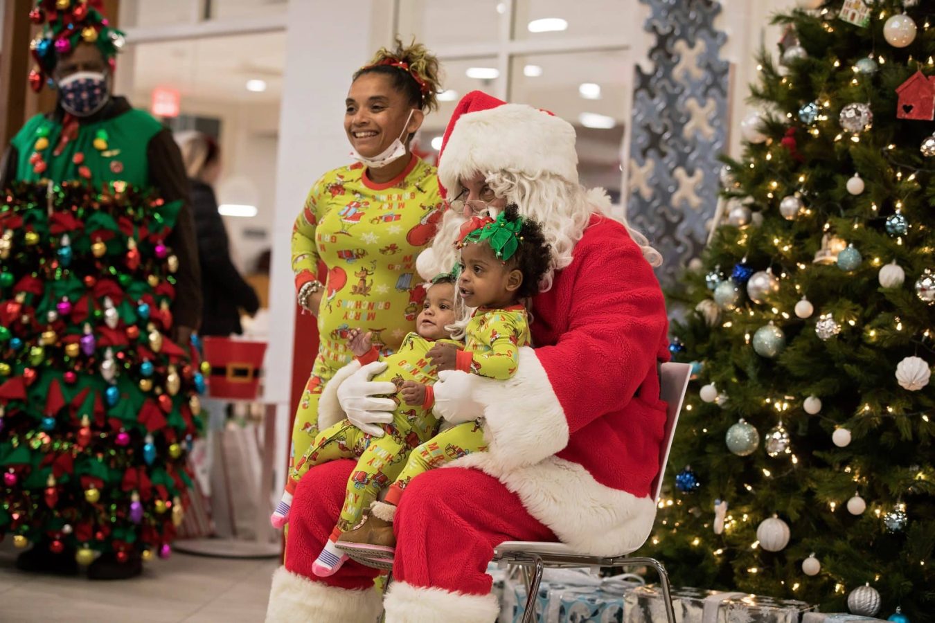Image from Comfort and Joy - Children taking a picture with Santa